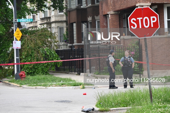 Police officers are gathering at the crime scene for the investigation in Chicago, Illinois, United States, on June 1, 2024. A 40-year-old m...