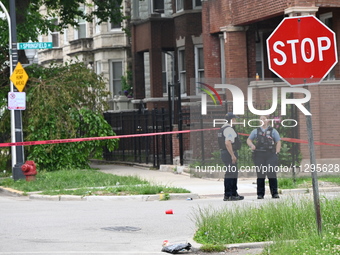 Police officers are gathering at the crime scene for the investigation in Chicago, Illinois, United States, on June 1, 2024. A 40-year-old m...