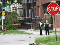 Police officers are gathering at the crime scene for the investigation in Chicago, Illinois, United States, on June 1, 2024. A 40-year-old m...