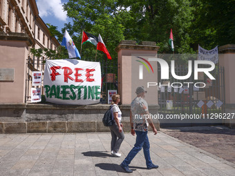 'Free Palestine' banner is seen on a fence while students hold occupational strike in the yard of Jagiellonian University in Krakow, Poland...