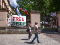 'Free Palestine' banner is seen on a fence while students hold occupational strike in the yard of Jagiellonian University in Krakow, Poland...