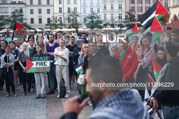 People attend pro-paletine demonstration while students hold occupational strike in the yard of Jagiellonian University in Krakow, Poland on...