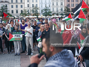 People attend pro-paletine demonstration while students hold occupational strike in the yard of Jagiellonian University in Krakow, Poland on...