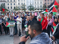 People attend pro-paletine demonstration while students hold occupational strike in the yard of Jagiellonian University in Krakow, Poland on...