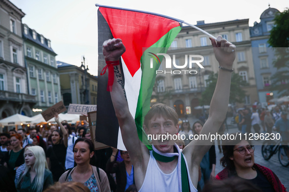 People attend pro-paletine demonstration while students hold occupational strike in the yard of Jagiellonian University in Krakow, Poland on...