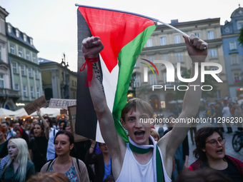 People attend pro-paletine demonstration while students hold occupational strike in the yard of Jagiellonian University in Krakow, Poland on...