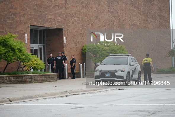 Police vehicles are outside of Chicago Ridge Mall. Heavy police presence is following reports of an unconfirmed shooting at Chicago Ridge Ma...