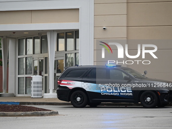 Police vehicles are outside of Chicago Ridge Mall. Heavy police presence is following reports of an unconfirmed shooting at Chicago Ridge Ma...