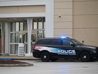 Police vehicles are outside of Chicago Ridge Mall. Heavy police presence is following reports of an unconfirmed shooting at Chicago Ridge Ma...