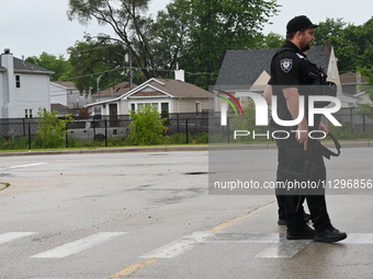 A police officer with a heavy weapon is staging at Chicago Ridge Mall. Heavy police presence is following reports of an unconfirmed shooting...