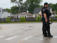 A police officer with a heavy weapon is staging at Chicago Ridge Mall. Heavy police presence is following reports of an unconfirmed shooting...