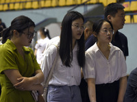 Job seekers are looking for a suitable position at a job fair held by industrial reform enterprises in Huai'an, China, on June 2, 2024. (