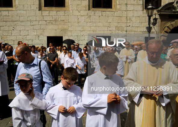 The Corpus Christi procession is walking through the city streets in Krakow, Poland, on May 30, 2024. The Solemnity of the Most Holy Body an...