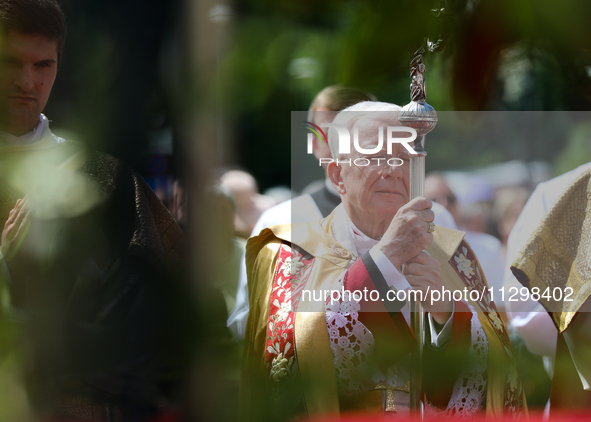 Metropolitan Archbishop of Krakow Marek Jedraszeski is walking during the Corpus Christi procession through the city streets in Krakow, Pola...