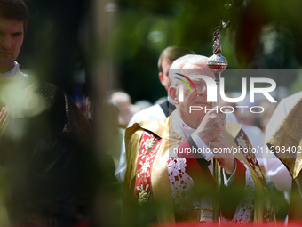 Metropolitan Archbishop of Krakow Marek Jedraszeski is walking during the Corpus Christi procession through the city streets in Krakow, Pola...