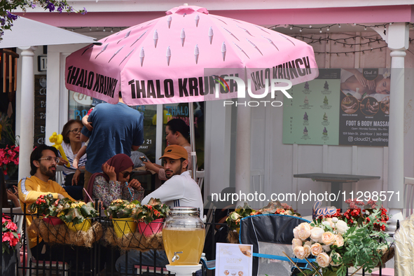 People are enjoying some food on an outdoor patio in Unionville, Ontario, Canada, on June 03, 2023. 