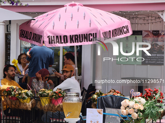 People are enjoying some food on an outdoor patio in Unionville, Ontario, Canada, on June 03, 2023. (