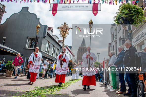 Thousands of people are attending the ''Boxmeerse Vaart,'' an ancient Holy Blood procession, in Boxmeer, Netherlands, on June 2, 2024. 