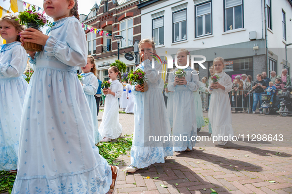 Thousands of people are attending the ''Boxmeerse Vaart,'' an ancient Holy Blood procession, in Boxmeer, Netherlands, on June 2, 2024. 