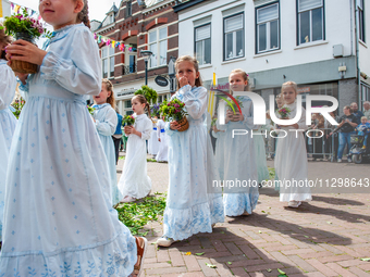 Thousands of people are attending the ''Boxmeerse Vaart,'' an ancient Holy Blood procession, in Boxmeer, Netherlands, on June 2, 2024. (