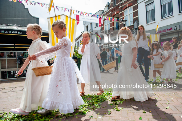 Thousands of people are attending the ''Boxmeerse Vaart,'' an ancient Holy Blood procession, in Boxmeer, Netherlands, on June 2, 2024. 