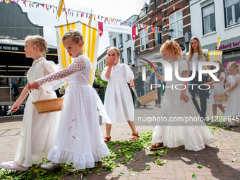 Thousands of people are attending the ''Boxmeerse Vaart,'' an ancient Holy Blood procession, in Boxmeer, Netherlands, on June 2, 2024. (