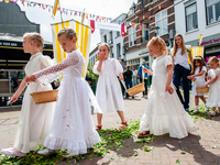 Thousands of people are attending the ''Boxmeerse Vaart,'' an ancient Holy Blood procession, in Boxmeer, Netherlands, on June 2, 2024. (