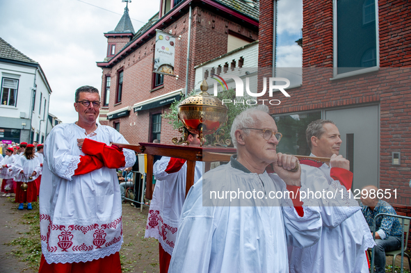 Thousands of people are attending the ''Boxmeerse Vaart,'' an ancient Holy Blood procession, in Boxmeer, Netherlands, on June 2, 2024. 