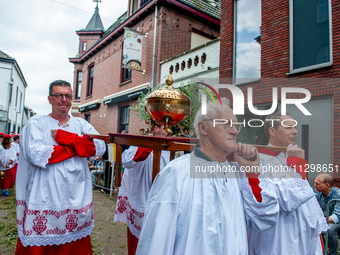 Thousands of people are attending the ''Boxmeerse Vaart,'' an ancient Holy Blood procession, in Boxmeer, Netherlands, on June 2, 2024. (