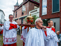 Thousands of people are attending the ''Boxmeerse Vaart,'' an ancient Holy Blood procession, in Boxmeer, Netherlands, on June 2, 2024. (