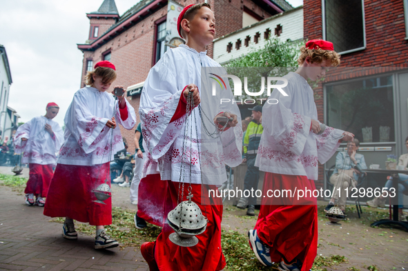 Thousands of people are attending the ''Boxmeerse Vaart,'' an ancient Holy Blood procession, in Boxmeer, Netherlands, on June 2, 2024. 