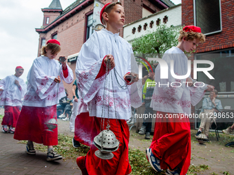 Thousands of people are attending the ''Boxmeerse Vaart,'' an ancient Holy Blood procession, in Boxmeer, Netherlands, on June 2, 2024. (