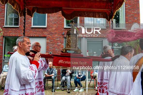 Thousands of people are attending the ''Boxmeerse Vaart,'' an ancient Holy Blood procession, in Boxmeer, Netherlands, on June 2, 2024. 