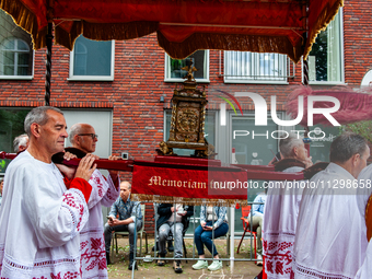 Thousands of people are attending the ''Boxmeerse Vaart,'' an ancient Holy Blood procession, in Boxmeer, Netherlands, on June 2, 2024. (