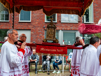 Thousands of people are attending the ''Boxmeerse Vaart,'' an ancient Holy Blood procession, in Boxmeer, Netherlands, on June 2, 2024. (