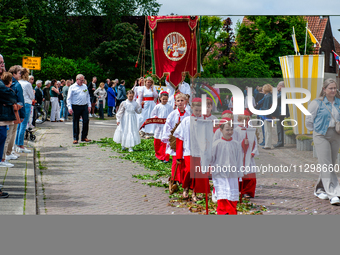 Thousands of people are attending the ''Boxmeerse Vaart,'' an ancient Holy Blood procession, in Boxmeer, Netherlands, on June 2, 2024. (