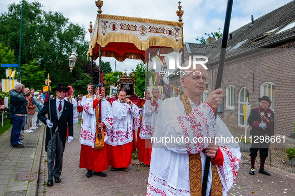 Thousands of people are attending the ''Boxmeerse Vaart,'' an ancient Holy Blood procession, in Boxmeer, Netherlands, on June 2, 2024. 