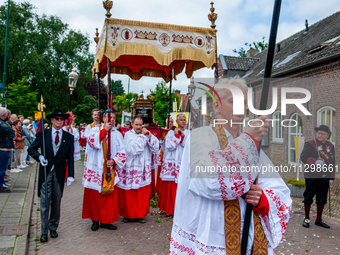 Thousands of people are attending the ''Boxmeerse Vaart,'' an ancient Holy Blood procession, in Boxmeer, Netherlands, on June 2, 2024. (