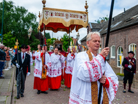 Thousands of people are attending the ''Boxmeerse Vaart,'' an ancient Holy Blood procession, in Boxmeer, Netherlands, on June 2, 2024. (