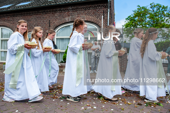 Thousands of people are attending the ''Boxmeerse Vaart,'' an ancient Holy Blood procession, in Boxmeer, Netherlands, on June 2, 2024. 