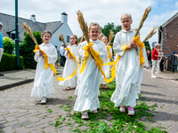 Thousands of people are attending the ''Boxmeerse Vaart,'' an ancient Holy Blood procession, in Boxmeer, Netherlands, on June 2, 2024. (