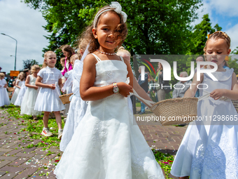 Thousands of people are attending the ''Boxmeerse Vaart,'' an ancient Holy Blood procession, in Boxmeer, Netherlands, on June 2, 2024. (