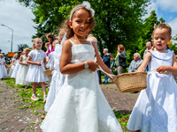 Thousands of people are attending the ''Boxmeerse Vaart,'' an ancient Holy Blood procession, in Boxmeer, Netherlands, on June 2, 2024. (