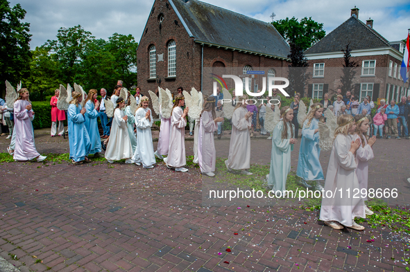 Thousands of people are attending the ''Boxmeerse Vaart,'' an ancient Holy Blood procession, in Boxmeer, Netherlands, on June 2, 2024. 