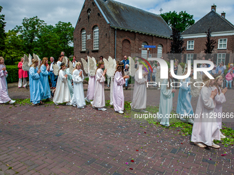 Thousands of people are attending the ''Boxmeerse Vaart,'' an ancient Holy Blood procession, in Boxmeer, Netherlands, on June 2, 2024. (