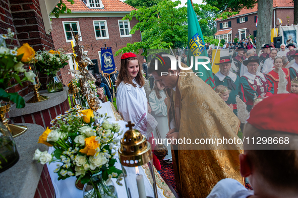 Thousands of people are attending the ''Boxmeerse Vaart,'' an ancient Holy Blood procession, in Boxmeer, Netherlands, on June 2, 2024. 