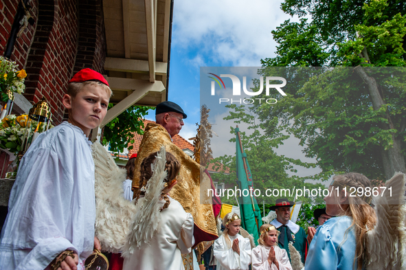 Thousands of people are attending the ''Boxmeerse Vaart,'' an ancient Holy Blood procession, in Boxmeer, Netherlands, on June 2, 2024. 