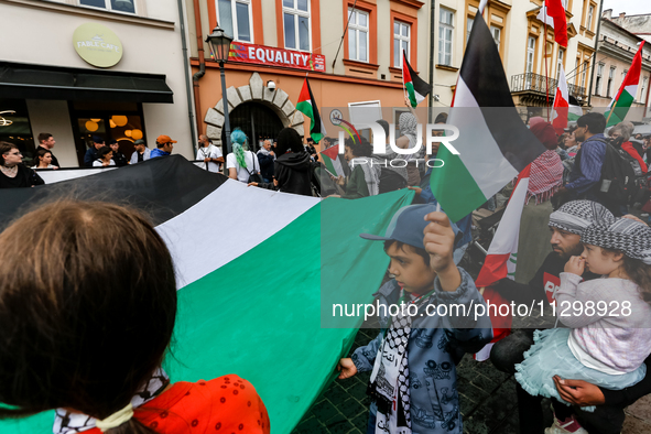 Palestinians and their supporters hold a protest in support of Palestine and against Israeli war actions in the Gaza Strip in fron of the Un...