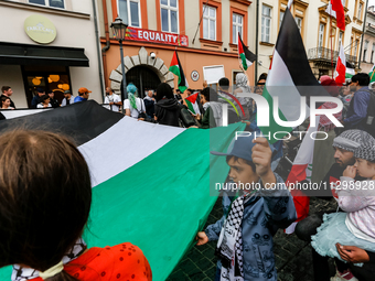 Palestinians and their supporters hold a protest in support of Palestine and against Israeli war actions in the Gaza Strip in fron of the Un...