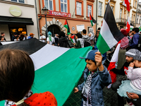 Palestinians and their supporters hold a protest in support of Palestine and against Israeli war actions in the Gaza Strip in fron of the Un...